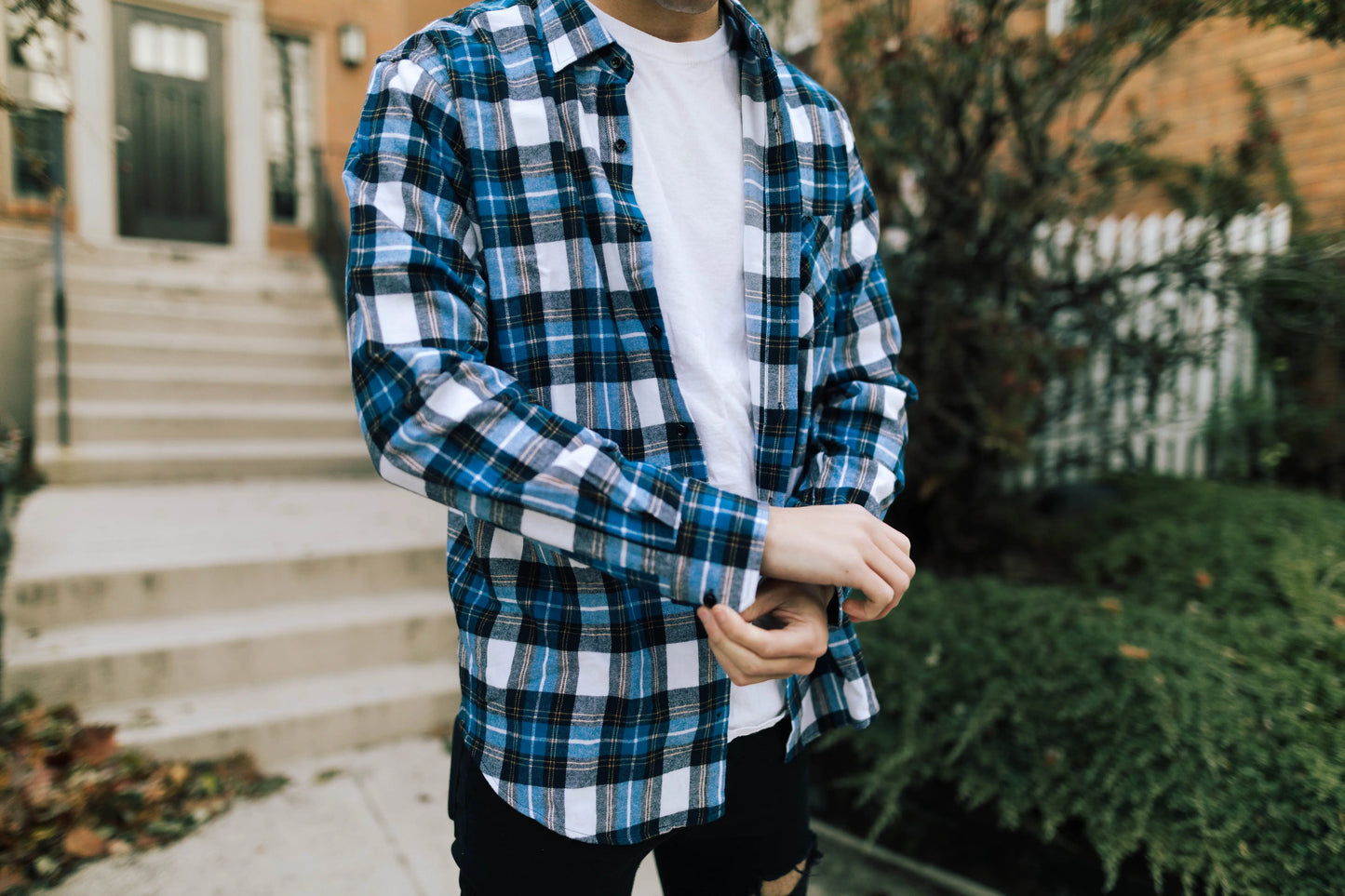 Model wearing Blue, Yellow, Black and White Plaid Flannel by Dumbsmart New York